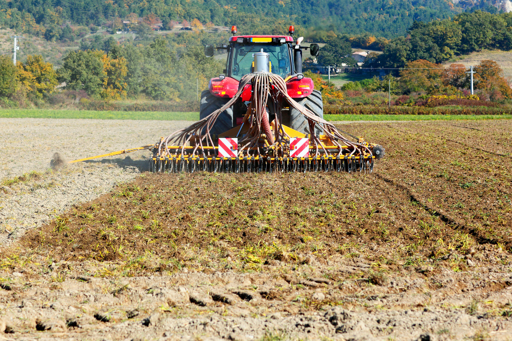ploughing heavy tractor during cultivation agriculture works field with plough